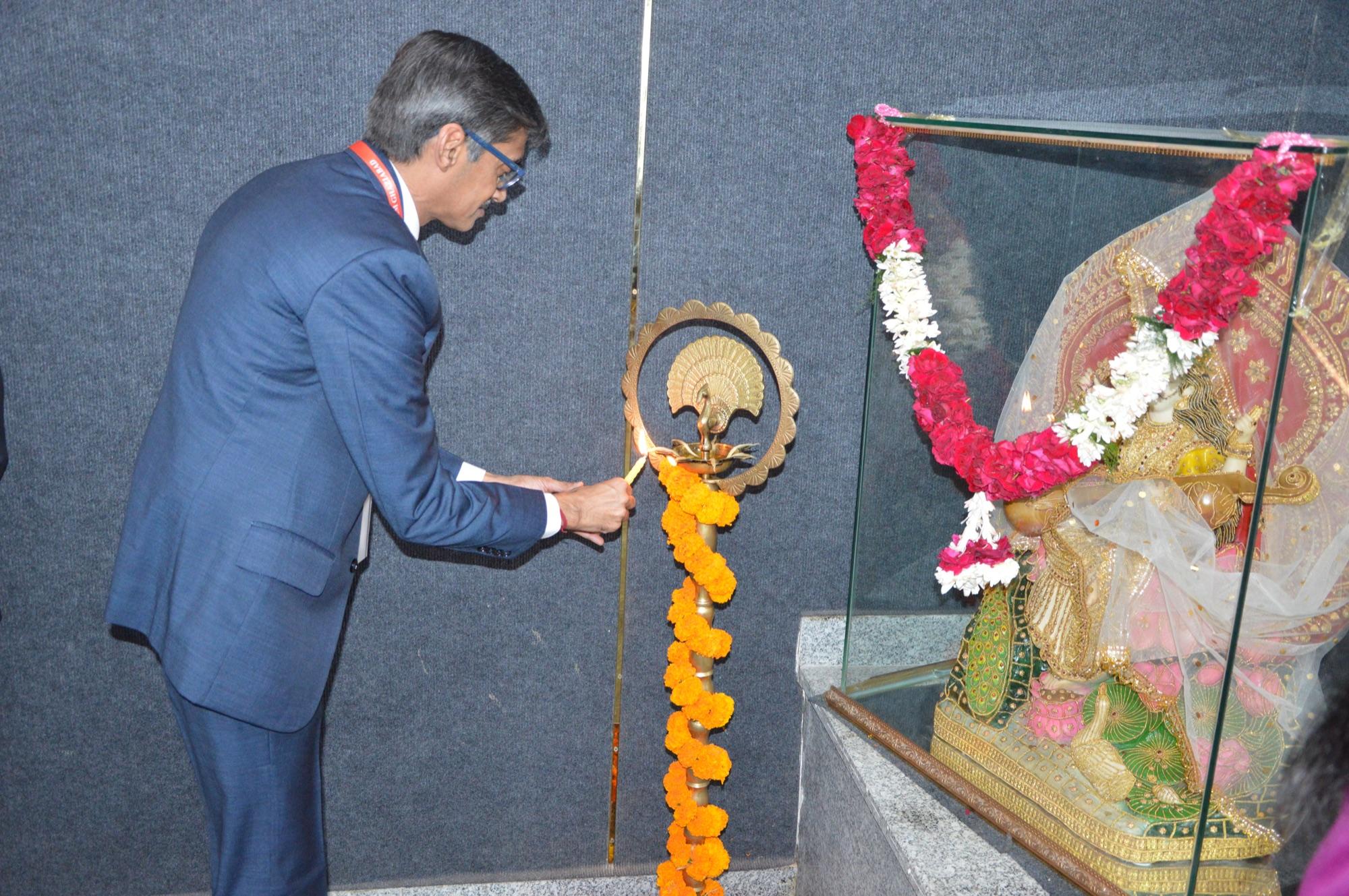 Lamp lighting continues before the inaugural session.