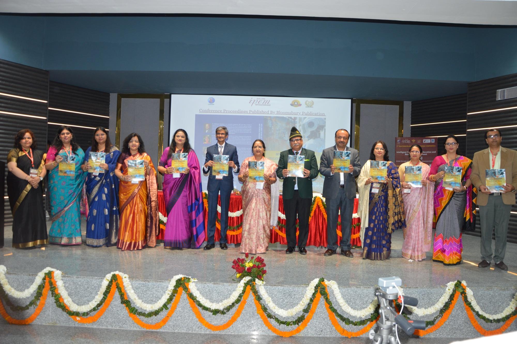 Release of the conference souvenir by the dignitaries on stage.